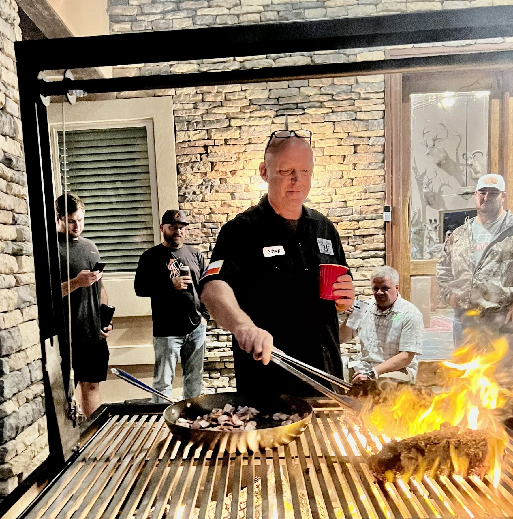 Ship cooking outdoors at the grill