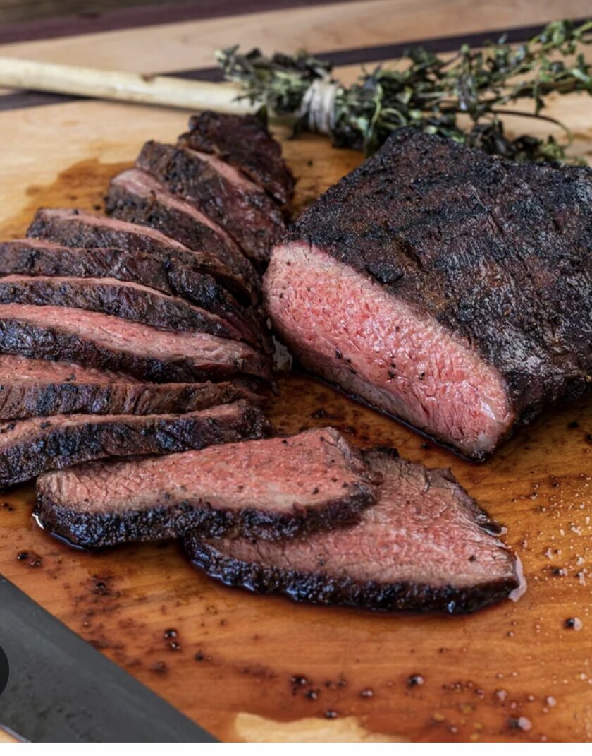 Smoked and seared tri-tip sliced across the grain with a dark crust and rosy center
